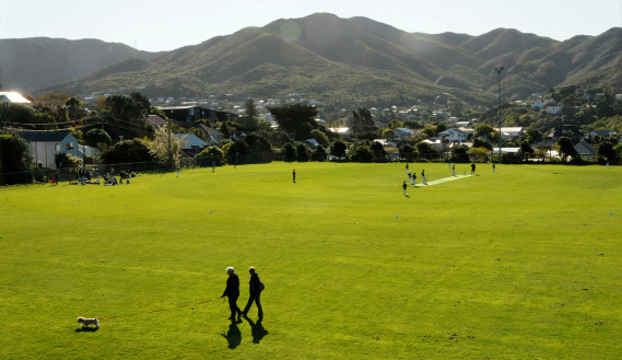 People walk and play sports in a park in Wellington, New Zealand. (Photo: Jenny Trevelyan/IMF)