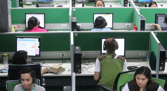 Employees work at a call center in Davao City, Philippines: investing more in digital infrastructure can further support the country’s outsourcing industry (photo: Lean Daval Jr/Reuters/Newscom)