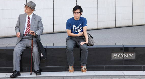An older and a younger man sit in Tokyo’s Ginza district. By 2050 the number of aged dependents per worker will rise to about 75%, the highest of any country. (photo: Friso Genrsch/picture alliance/Newscom)