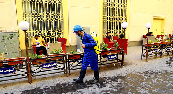 A worker disinfects the streets of Cairo. The health crisis has severely hit Egypt’s tourism industry, one of the country's main sources of income. (photo: Xinhua News Agency/Newscom)