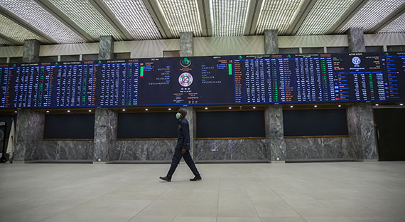 A man walking in the Pakistan Stock Exchange building. The pandemic has increased financing needs in Pakistan and other countries across the region. (photo: IMF)