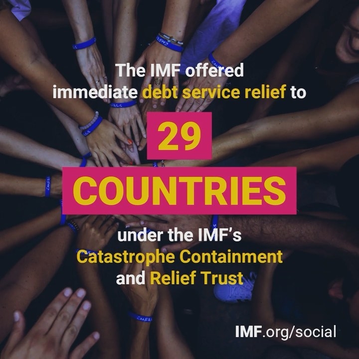 Photo by International Monetary Fund showing hands from multiple people converging in the center with text on top that says 'The IMF offered immediate debt service relief to 29 countries under the IMF's Catastrophe Containment and Relief Trust'