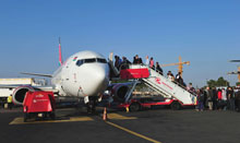Passengers board an airplane in Nairobi, Kenya.
