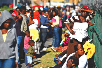 South Africans in line outside Guguletu Social Services office in Cape Town, South Africa.