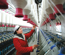 Worker in yarn factory, Huaibei, Anhui, China