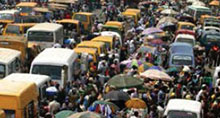 Commuters and traders at a Nigerian market.