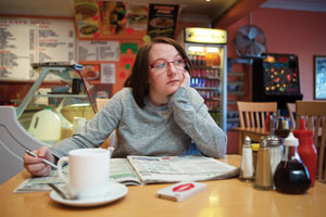 Ann-Marie Taylor searches through job listings in a café in London, United Kingdom.
