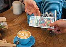 Bristol pounds being spent in a local coffee shop.