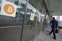 Attendee enters Inside Bitcoins conference, New York City, United States.