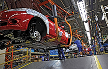 Ford workers producing new cars at plant in São Paulo, Brazil.