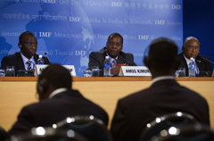 African Finance Ministers Abdoulaye Diop (L), Minister of Economy, Finance, and Planning for Senegal, Amos Kimonya (C), Minister of Finance from Kenya, and John Benjamin (R), Minister of Finance from Sierra Leone, hold a press conference at the Suntec Convention Center in Singapore