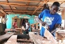 Carpentry shop in Monrovia, Liberia. Strong activity in Africa’s low-income countries offsets slowdown in middle-income countries (IMF photo) 