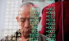 Man reflected in Shanghai stock exchange electronic screen.  Asia should benefit from the ongoing global economic recovery, suggests the IMF (photo: TPS/Top Photos/Corbis) 