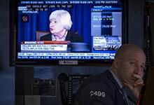 Fed chair Janet Yellen on television on floor of New York Stock Exchange:  U.S. central bank policy has begun to return to normal (photo: Brendan McDermid/Reuters) 