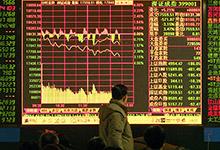 Инвестор в Китае: финансовые риски смещаются в сторону теневых банков и из стран с развитой экономикой в страны с формирующимся рынком (фото: Bei Feng/epa/Corbis). 